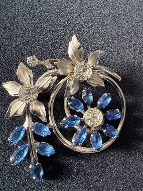 Silver-Tone Floral Brooch with Blue Crystal Petals